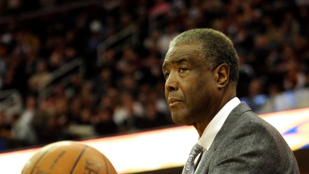 Former Cleveland Cavaliers and Charlotte Bobcats head coach Paul Silas holds the ball in the second quarter of a game coaching against the Cavaliers at Quicken Loans Arena in April of 2012.