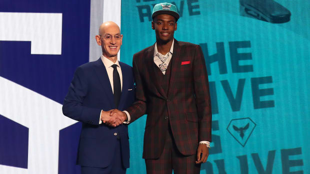 Jun 22, 2023; Brooklyn, NY, USA; Brandon Miller poses with NBA commissioner Adam Silver after being selected second by the Charlotte Hornets in the first round of the 2023 NBA Draft