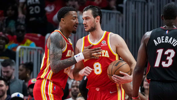 Apr 22, 2022; Atlanta, Georgia, USA; Atlanta Hawks forwards John Collins (20) and Danilo Gallinari (8) react after a basket against the Miami Heat during the first half of game three of the first round for the 2022 NBA playoffs at State Farm Arena.
