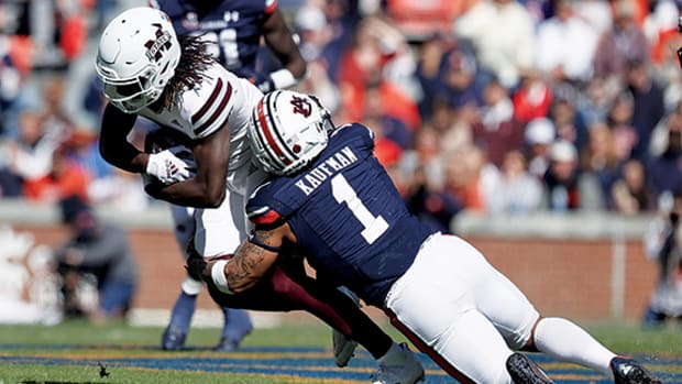 Mississippi State Bulldogs wide receiver Jaden Walley (11) is tackled by Auburn Tigers safety Donovan Kaufman (1) during the first quarter at Jordan-Hare Stadium.