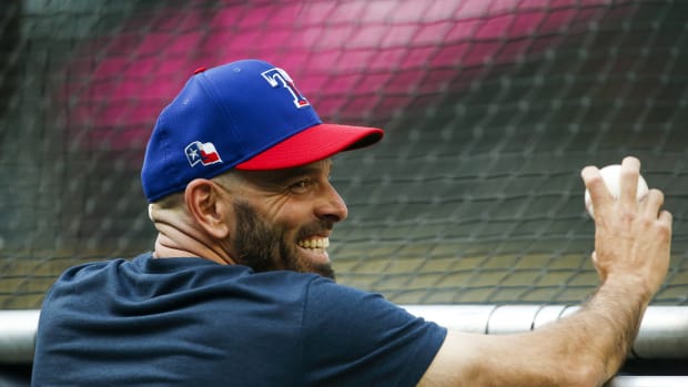 Jul 2, 2021; Seattle, Washington, USA; Texas Rangers manager Chris Woodward (8) talks with players during batting practice before a game against the Seattle Mariners at T-Mobile Park. Mandatory Credit: Joe Nicholson-USA TODAY Sports