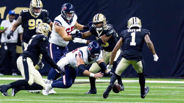 Texans center Jarrett Patterson recovers a fumble against the New Orleans Saints during the first half at the Caesars Superdome.