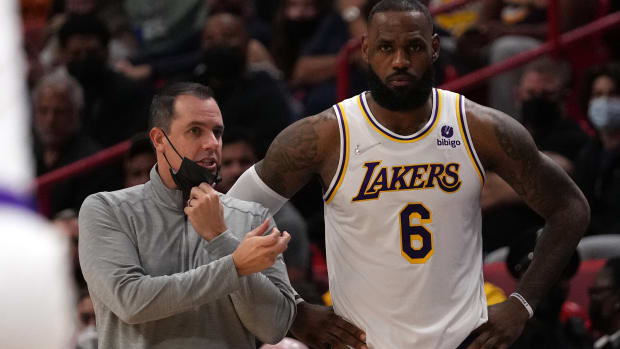 Los Angeles Lakers forward LeBron James next to coach Frank Vogel.