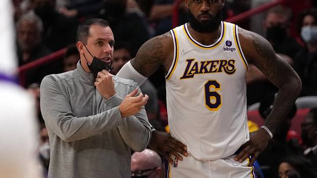 Los Angeles Lakers forward LeBron James next to coach Frank Vogel.