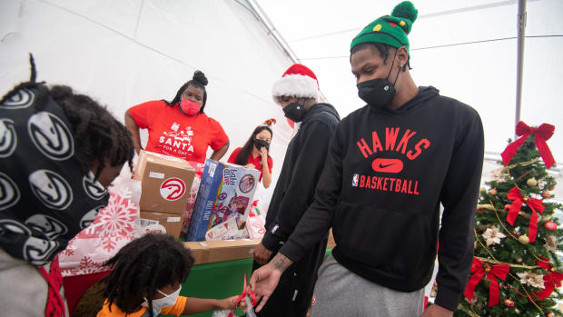 Atlanta Hawks players distribute 1,500 gifts to underserved youth on December 18, 2021.