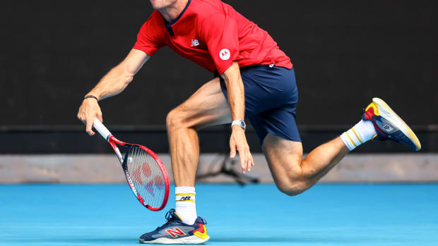 Tommy Paul returns a serve during the 2024 Australian Open.