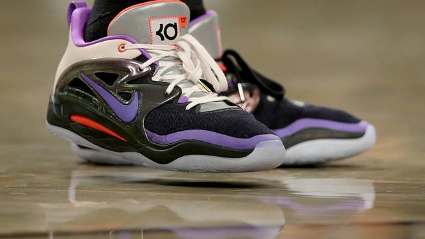 View of Kevin Durant's black and purple Nike shoes.