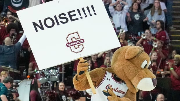 Nov 20, 2022; Charleston, South Carolina, USA; Charleston Cougars mascot Clyde gives the crowd some instructions in the second half against the Virginia Tech Hokies at TD Arena. Mandatory Credit: David Yeazell-USA TODAY Sports