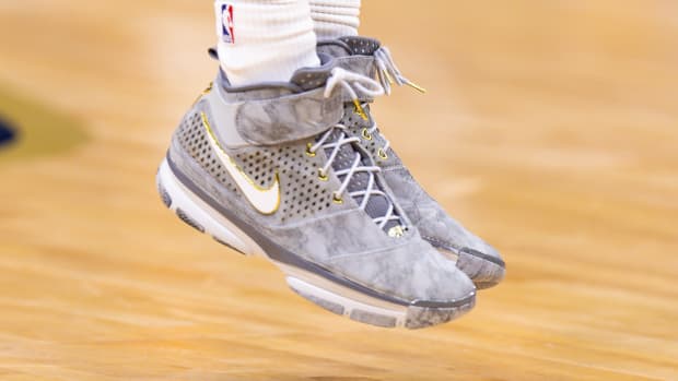 View of grey and white Nike Kobe shoes.
