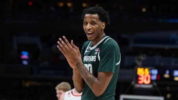 Michigan State Spartans forward Marcus Bingham Jr. (30) applauds the fans in the second half against the Wisconsin Badgers at Gainbridge Fieldhouse.