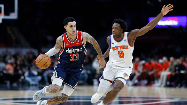 Washington Wizards forward Kyle Kuzma (33) drives to the basket as New York Knicks forward OG Anunoby (8) defends in the third quarter at Capital One Arena.
