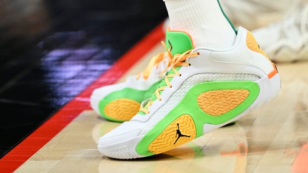 Boston Celtics forward Jayson Tatum's white and green Jordan Brand sneakers.