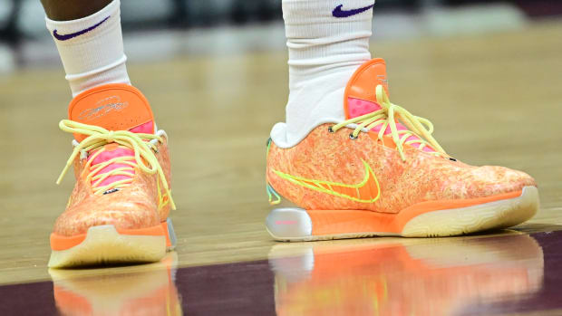 Los Angeles Lakers forward LeBron James' orange and yellow Nike sneakers.