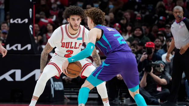 Chicago Bulls guard Lonzo Ball defends Charlotte Hornets guard LaMelo Ball