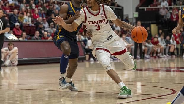 Stanford Cardinal guard Kanaan Carlyle (3) drives the lane against California Golden Bears guard Jalen Cone (15) during the second half at Maples Pavillion.