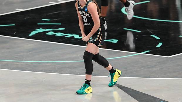 New York Liberty guard Sabrina Ionescu celebrates after a play.