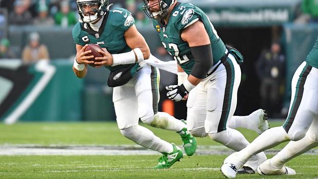 Philadelphia Eagles quarterback Jalen Hurts runs with the ball.