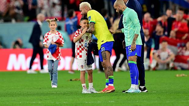Neymar pictured hugging Leonardo Perisic, son of Croatia soccer star Ivan Perisic, after Brazil were eliminated from the 2022 World Cup