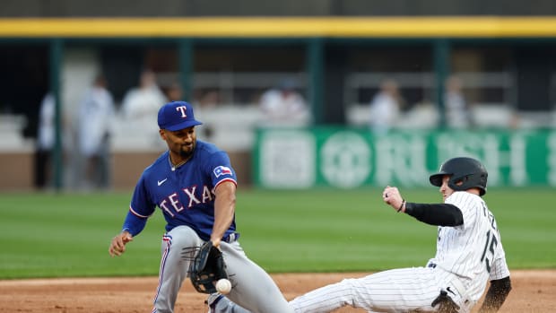 Jun 20, 2023; Chicago, Illinois, USA; Chicago White Sox right fielder Clint Frazier (15) steals second base as Texas Rangers second baseman Marcus Semien (2) is unable to catch the ball during the second inning at Guaranteed Rate Field. Mandatory Credit: Kamil Krzaczynski-USA TODAY Sports