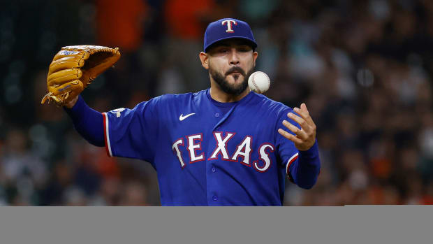 Aug 9, 2022; Houston, Texas, USA; Texas Rangers starting pitcher Martin Perez (54) reacts after a pitch during the fourth inning against the Houston Astros at Minute Maid Park. Mandatory Credit: Troy Taormina-USA TODAY Sports