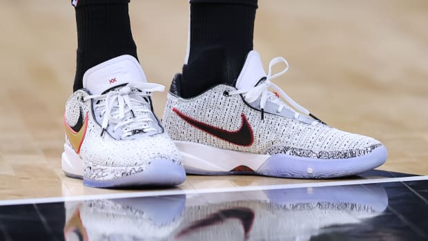 View of white and black Nike LeBron shoes.