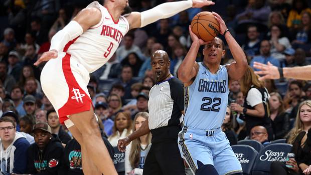 Grizzlies guard Desmond Bane shoots for three as Houston Rockets forward Dillon Brooks (9) defends during the first half at FedExForum.