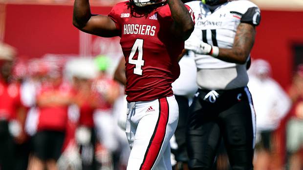 Cam Jones motions the number one after stopping a run during the first quarter against the Cincinnati Bearcats at Memorial Stadium.