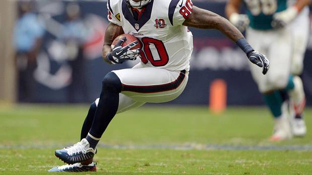 Texans receiver Andre Johnson (80) catches a pass against the Miami Dolphins at Reliant Stadium. The Texans defeated the Dolphins 30-10.