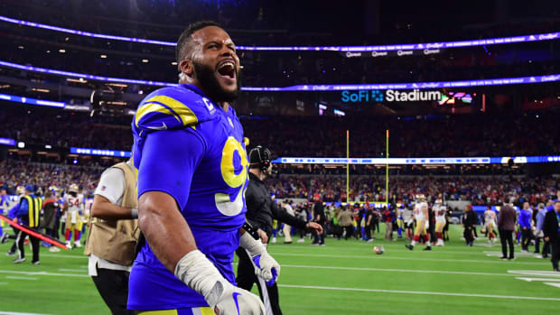 Jan 30, 2022; Inglewood, California, USA; Los Angeles Rams defensive end Aaron Donald (99) celebrates in the fourth quarter during the NFC Championship Game against the San Francisco 49ers at SoFi Stadium. Mandatory Credit: Gary A. Vasquez-USA TODAY Sports