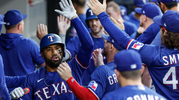 Jun 21, 2023; Chicago, Illinois, USA; Texas Rangers shortstop Ezequiel Duran (20) celebrates with teammates after hitting a two-run home run against the Chicago White Sox during the fourth inning at Guaranteed Rate Field. Mandatory Credit: Kamil Krzaczynski-USA TODAY Sports