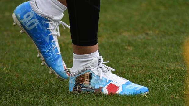 Pittsburgh Steelers linebacker T.J. Watt's blue and white Under Armour cleats.