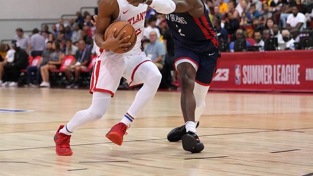 Atlanta Hawks guard Sharife Cooper (2) is hit in the face by New Orleans Pelicans guard Jared Harper (2) during an NBA Summer League game at Cox Pavilion.