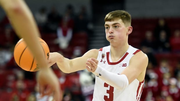 Wisconsin guard Connor Essegian passing the basketball against Lehigh.