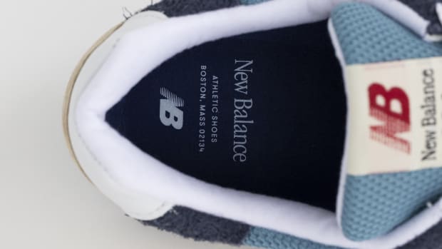 View of blue and white New Balance shoe insole.