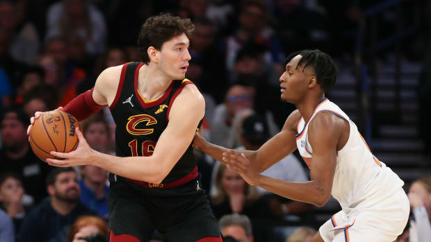 Cleveland Cavaliers forward Cedi Osman (16) and New York Knicks guard Immanuel Quickley (5) during the second half at Madison Square Garden.