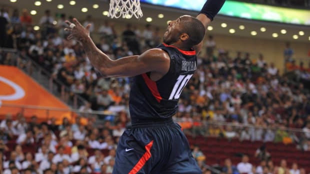 Team USA guard Kobe Bryant goes up for a dunk during a game.