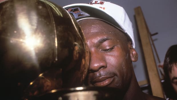 June 12, 1991; Los Angeles, CA, USA: Michael Jordan holding tight to his first NBA championship after the Chicago Bulls beat the Los Angeles Lakers in 1991 NBA Finals