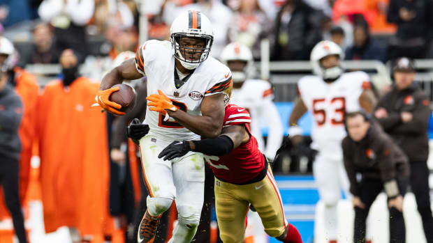 Oct 15, 2023; Cleveland, Ohio, USA; Cleveland Browns wide receiver Amari Cooper (2) runs the ball as San Francisco 49ers cornerback Deommodore Lenoir (2) pulls him down from behind during the fourth quarter at Cleveland Browns Stadium. Mandatory Credit: Scott Galvin-USA TODAY Sports