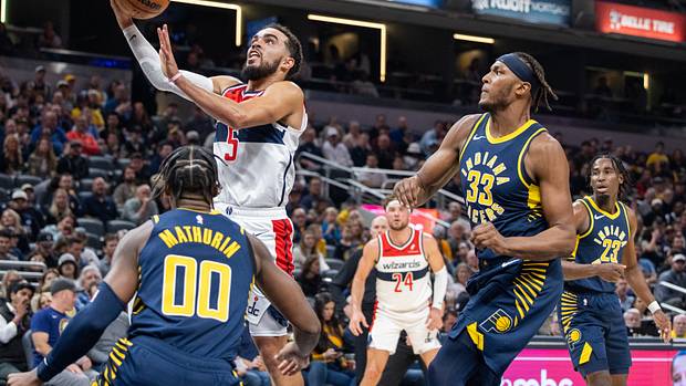 Washington Wizards guard Tyus Jones (5) shoots the ball while Indiana Pacers guard Bennedict Mathurin (00) defends in the second quarter at Gainbridge Fieldhouse.