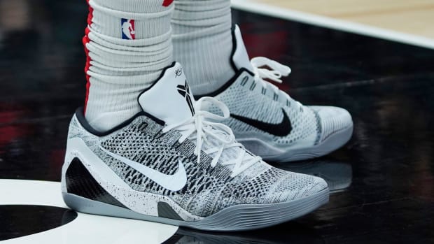 View of white and black Nike Kobe shoes.