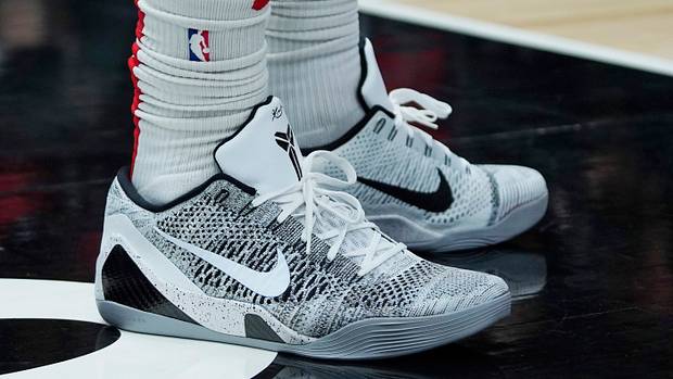View of white and black Nike Kobe shoes.