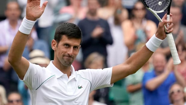 Novak Djokovic thanks the crowd at Wimbledon.