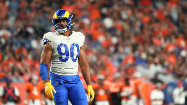 Aug 28, 2021; Denver, Colorado, USA; Los Angeles Rams defensive end Earnest Brown IV (90) looks on against the Denver Broncos during the second quarter at Empower Field at Mile High. Mandatory Credit: C. Morgan Engel-USA TODAY Sports