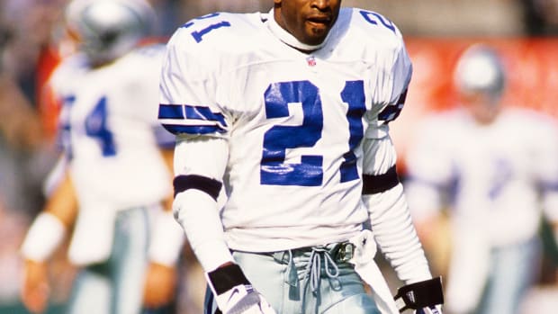 Dallas Cowboys defensive back Deion Sanders warms up before a game in 1996.