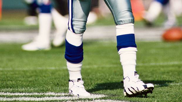 Dallas Cowboys defensive back Deion Sanders warms up before a game in 1996.