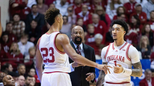 Indiana Hoosiers head coach Mike Woodson talks with Indiana Hoosiers forward Trayce Jackson-Davis (23) and guard Jalen Hood-Schifino (1) in the first half against the Michigan State Spartans at Simon Skjodt Assembly Hall.