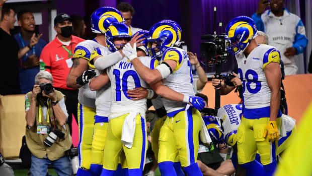 Feb 13, 2022; Inglewood, California, USA; Los Angeles Rams quarterback Matthew Stafford (9) celebrates with receiver Cooper Kupp (10) after scoring a touchdown in the fourth quarter against the Cincinnati Bengals in Super Bowl LVI at SoFi Stadium. Mandatory Credit: Gary A. Vasquez-USA TODAY Sports