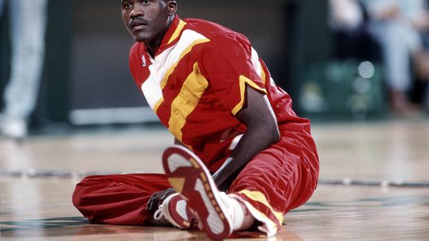 Hawks forward Dominique Wilkins stretches before a game.