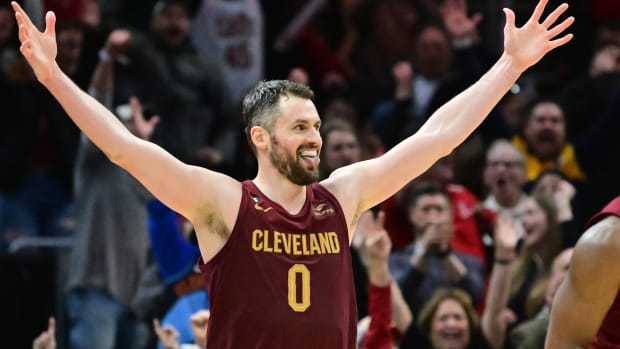 Jan 2, 2023; Cleveland, Ohio, USA; Cleveland Cavaliers forward Kevin Love (0) celebrates after guard Donovan Mitchell (not pictured) hit a three point basket during overtime against the Chicago Bulls at Rocket Mortgage FieldHouse. Mandatory Credit: Ken Blaze-USA TODAY Sports