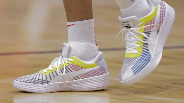 Washington Wizards forward Kyle Kuzma wears the Puma Clyde All-Pro 'White Blue Atoll' sneakers against New Orleans Pelicans on November 24, 2021.